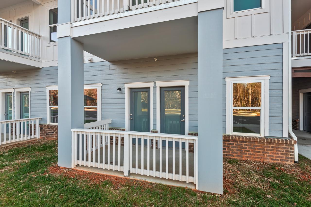 223 South Eleventh Street, Unit 103 Mebane, NC 27302 - Photo 37 of 41 a porch with a bench