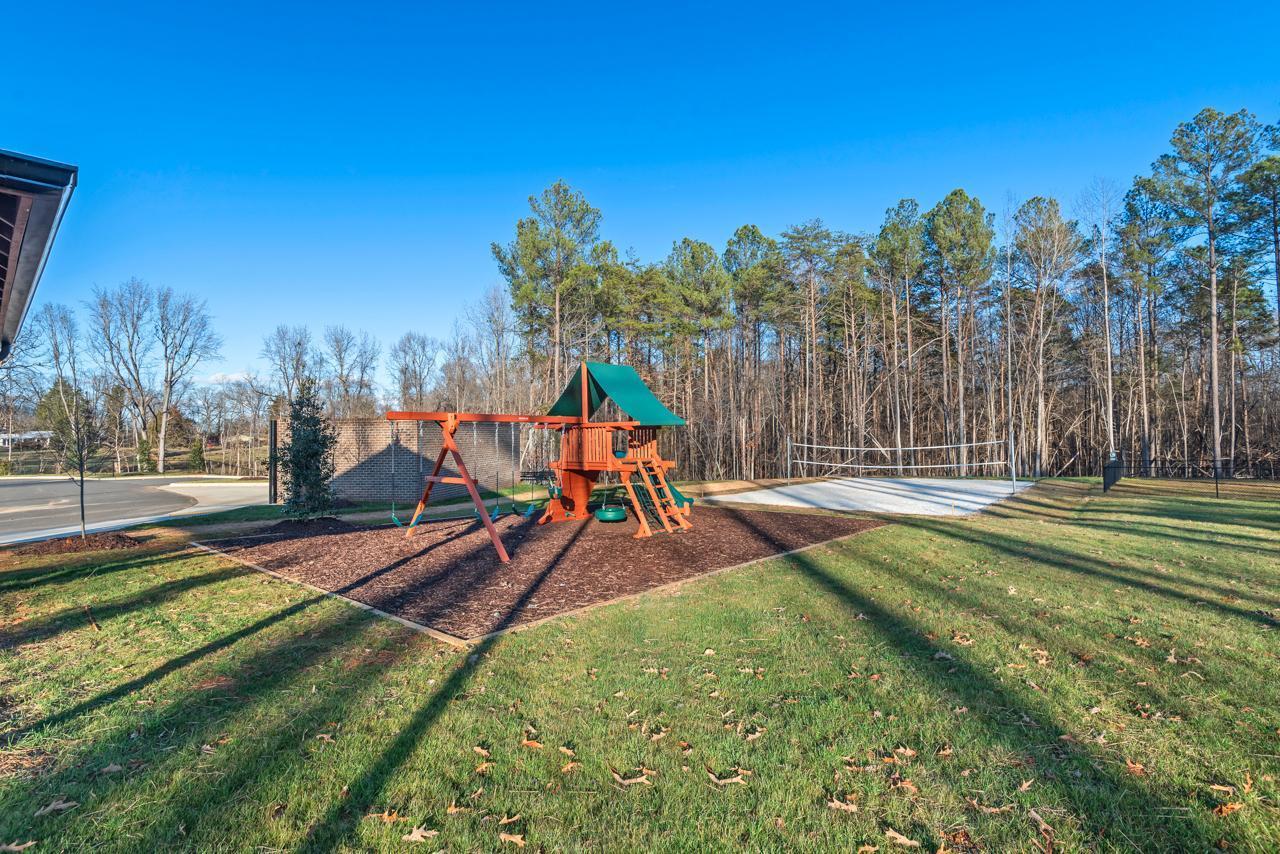 223 South Eleventh Street, Unit 103 Mebane, NC 27302 - Photo 39 of 41 a view of a park with swings and slides
