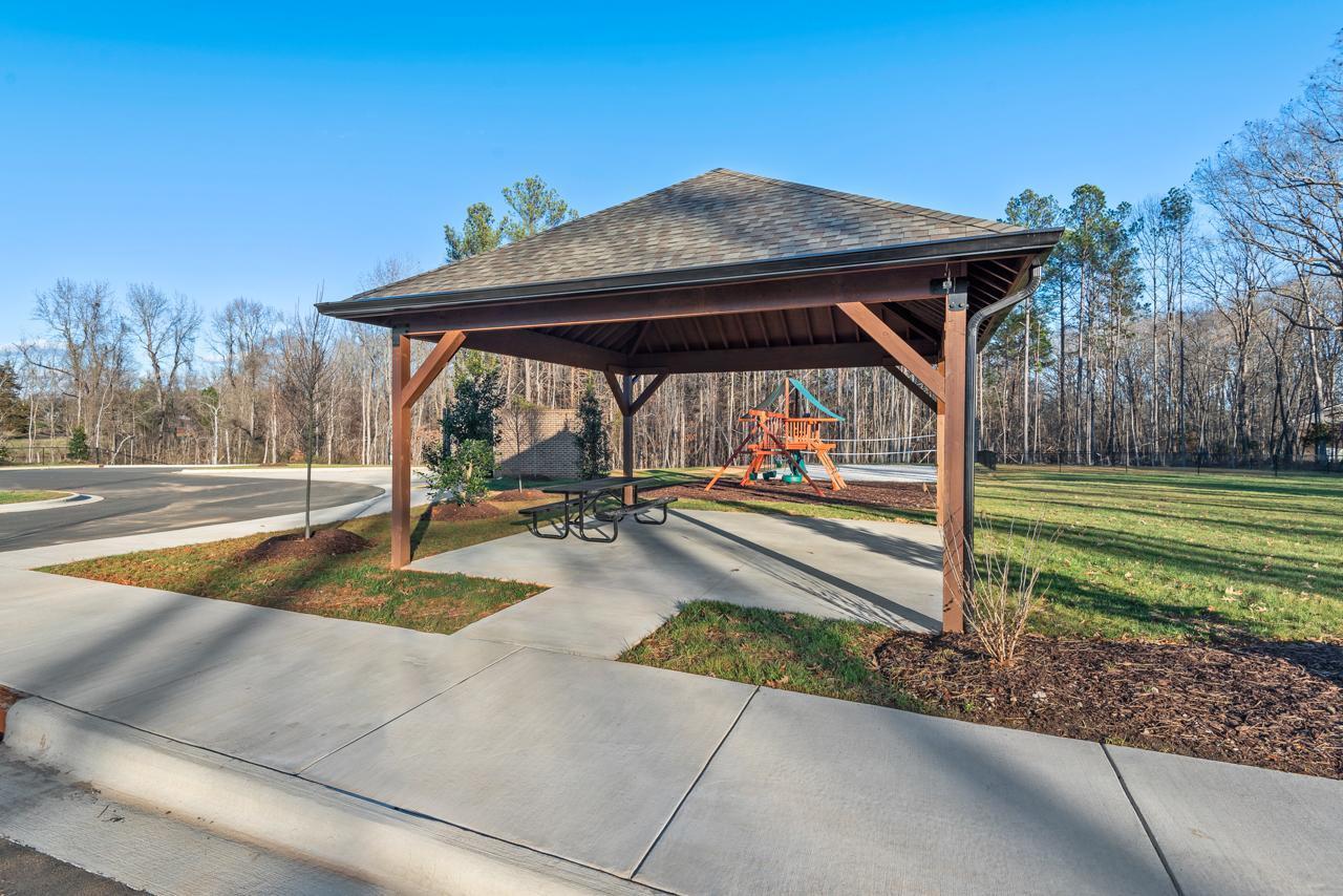 223 South Eleventh Street, Unit 103 Mebane, NC 27302 - Photo 40 of 41 a view of a swimming pool with a patio