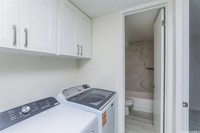 a utility room with dryer and washer