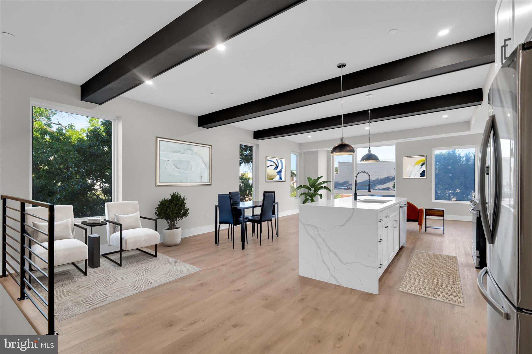 1915 Benning Road Northeast, Unit 6 Washington, DC 20002 - Photo 18 of 18 a living room with furniture and a large window