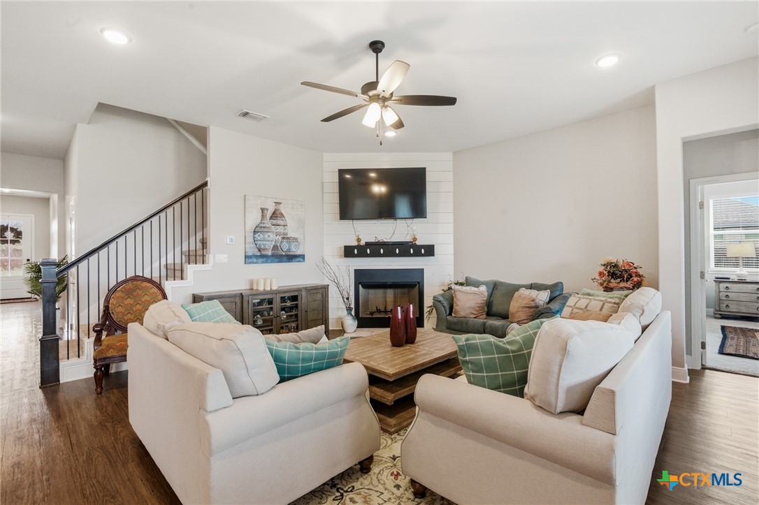 113 Terra Vista Ranch Road Victoria, TX 77904 - Photo 10 of 47 a living room with furniture a fireplace and a flat screen tv