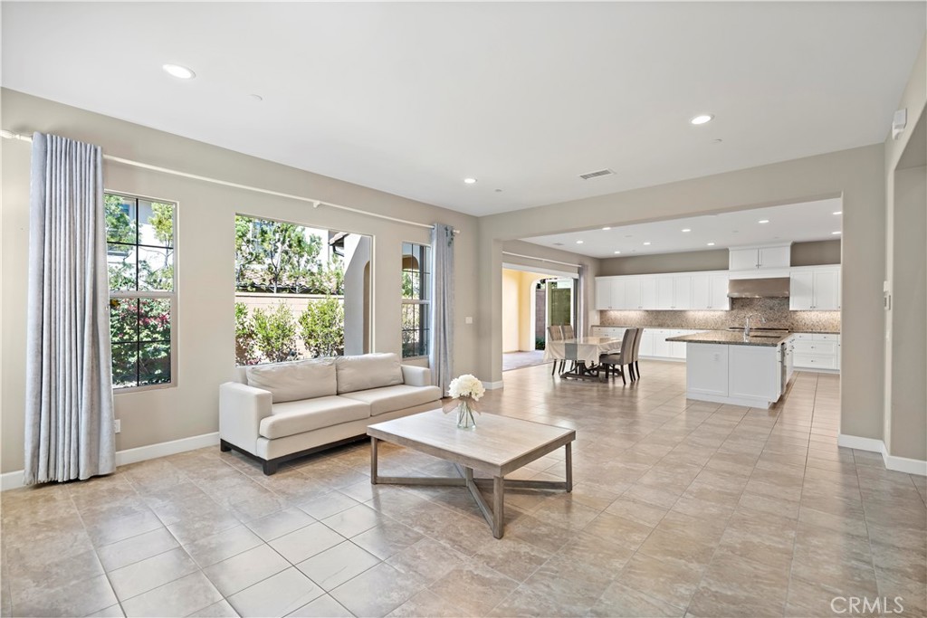121 Paxton Irvine, CA 92620 - Photo 12 of 61 a living room with furniture and a large window