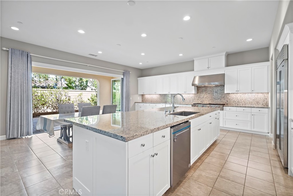 121 Paxton Irvine, CA 92620 - Photo 17 of 61 a kitchen with a sink stove and cabinets