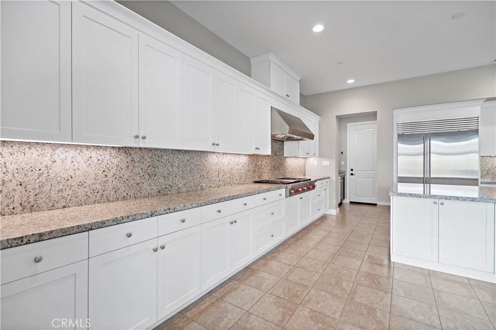 121 Paxton Irvine, CA 92620 - Photo 20 of 61 a large white kitchen with granite countertop a sink