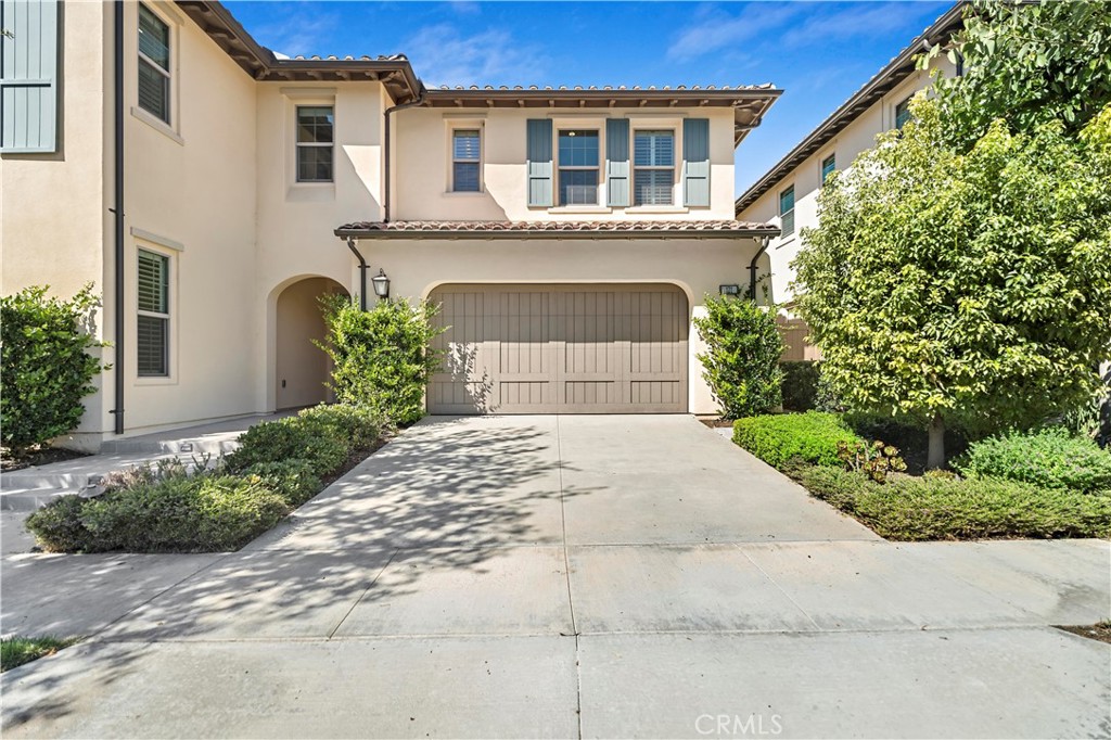 121 Paxton Irvine, CA 92620 - Photo 2 of 61 a front view of a house with a garden