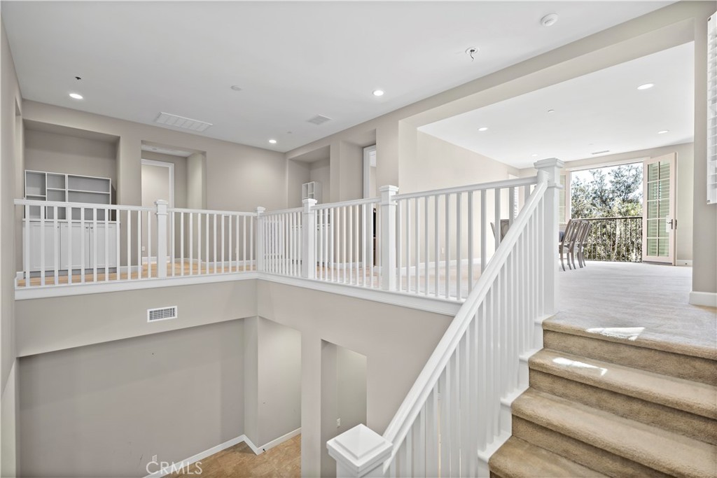 121 Paxton Irvine, CA 92620 - Photo 25 of 61 a view of entryway with stairs and wooden floor