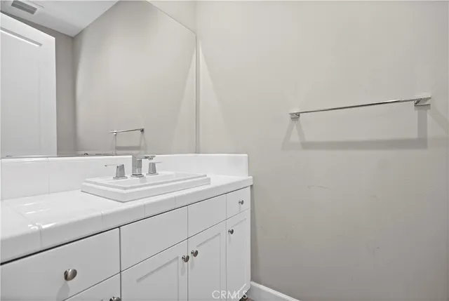 a spacious bedroom with a bed and a window