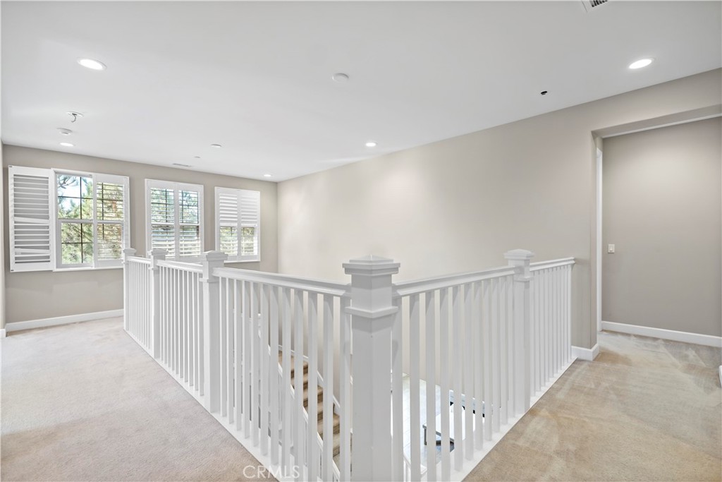121 Paxton Irvine, CA 92620 - Photo 29 of 61 a view of a hallway with windows