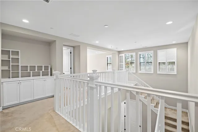 a bedroom with a large bed and a large window