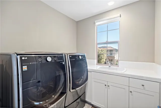 a spacious bedroom with a large bed and a large window