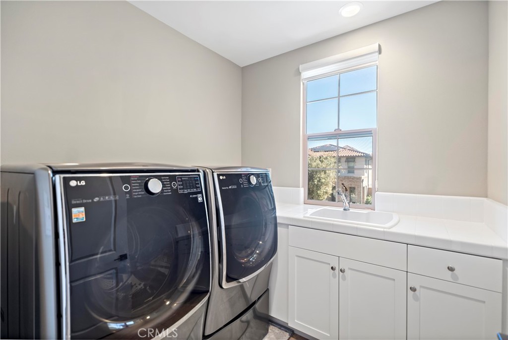121 Paxton Irvine, CA 92620 - Photo 32 of 61 a bathroom with a sink and a mirror