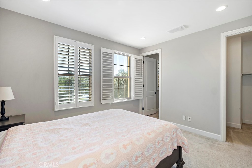 121 Paxton Irvine, CA 92620 - Photo 37 of 61 a bedroom with a large bed and a large window