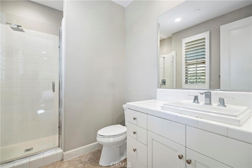 121 Paxton Irvine, CA 92620 - Photo 38 of 61 a bathroom with a toilet a sink and shower