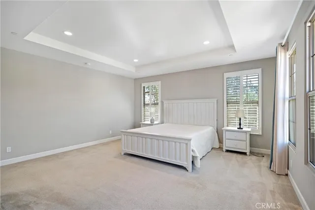 a spacious bathroom with a granite countertop tub sink and mirror
