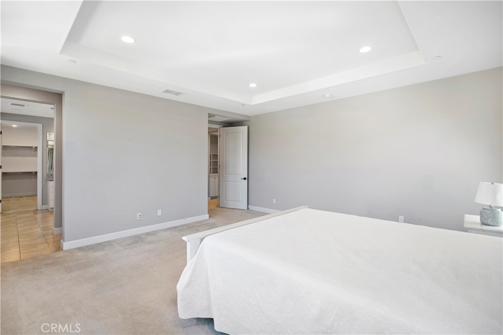 121 Paxton Irvine, CA 92620 - Photo 42 of 61 a bedroom with a bed and a night stand