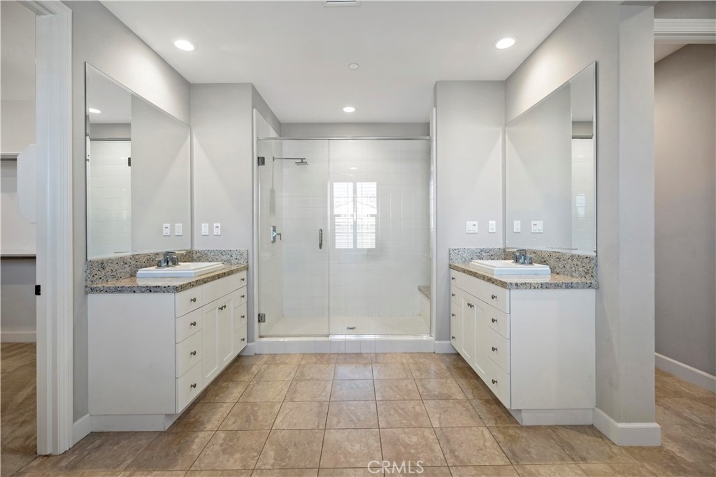 121 Paxton Irvine, CA 92620 - Photo 46 of 61 a bathroom with a granite countertop sink mirror and a