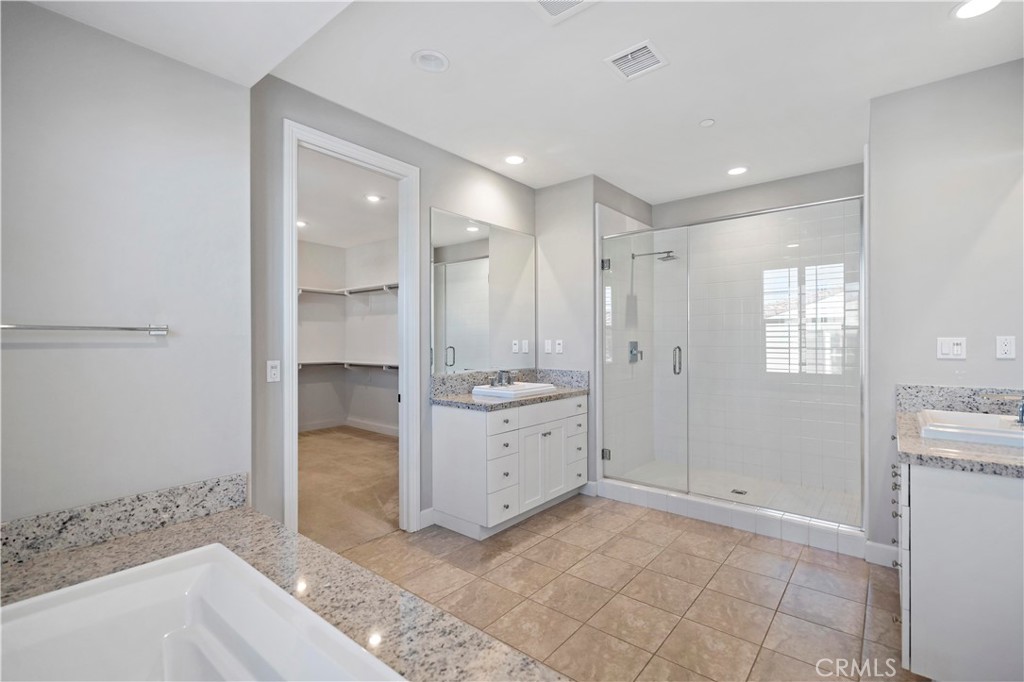 121 Paxton Irvine, CA 92620 - Photo 47 of 61 a bathroom with a shower a sink and a bathtub
