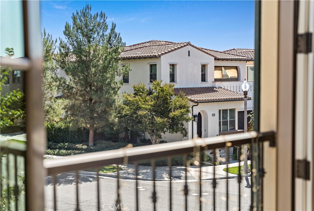 121 Paxton Irvine, CA 92620 - Photo 54 of 61 a view of a white house with a large windows and wooden fence