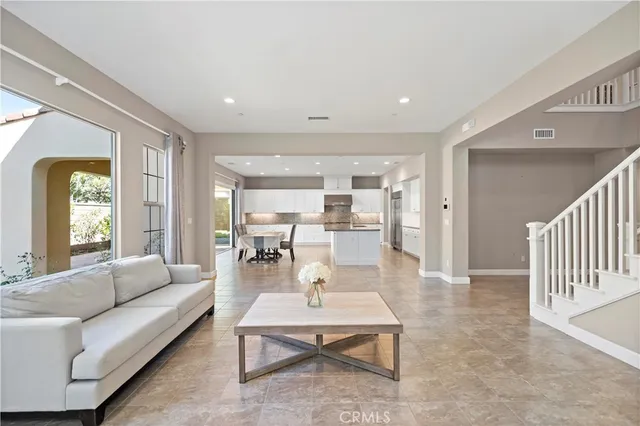 a living room with furniture and windows