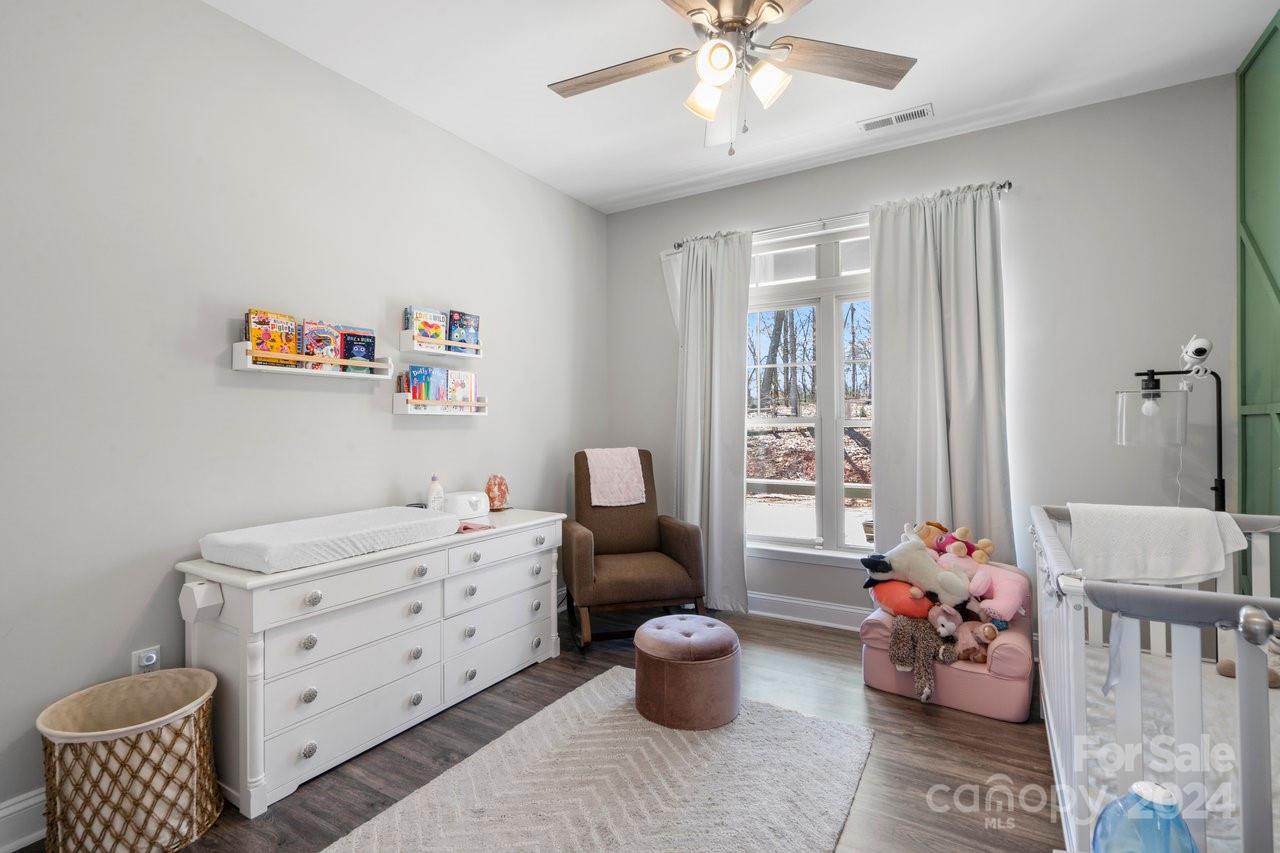 7609 Red Robin Trail Denver, NC 28037 - Photo 16 of 19 a room with furniture toys and a chandelier