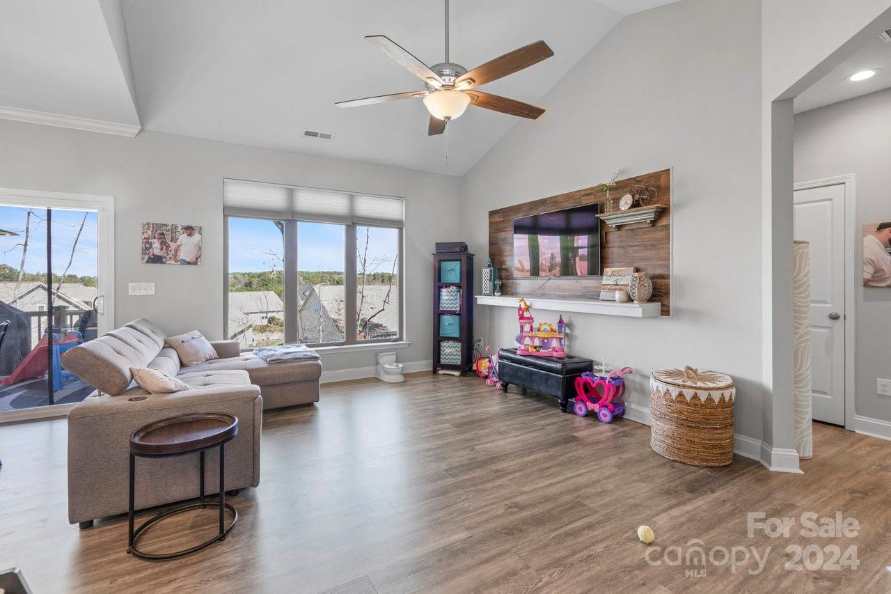 7609 Red Robin Trail Denver, NC 28037 - Photo 2 of 19 a living room with furniture and a large window