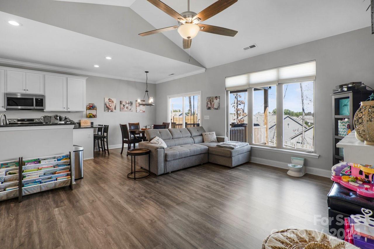 7609 Red Robin Trail Denver, NC 28037 - Photo 3 of 19 a living room with furniture and a large window