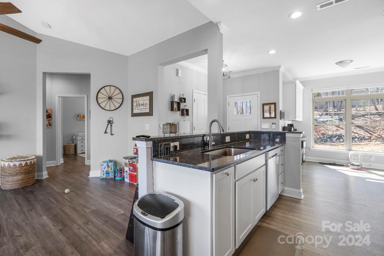 7609 Red Robin Trail Denver, NC 28037 - Photo 7 of 19 a kitchen with a stove and cabinets