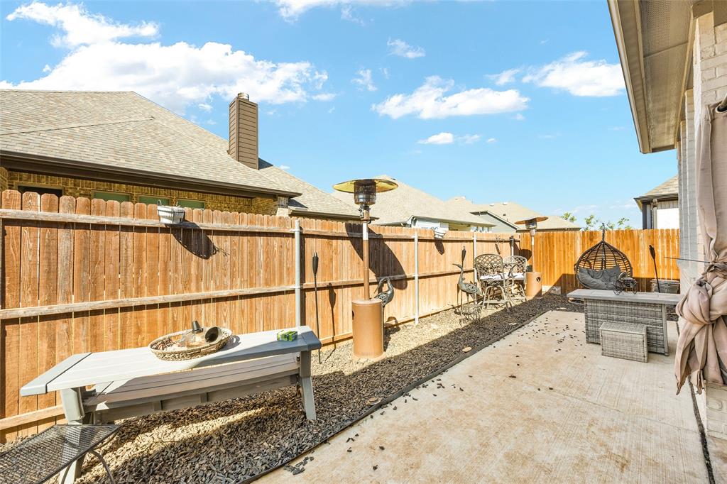 2628 Flycatcher Road Fort Worth, TX 76118 - Photo 32 of 38 Fenced backyard with a patio