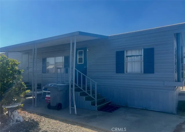 a brick house with a potted plant in front of it
