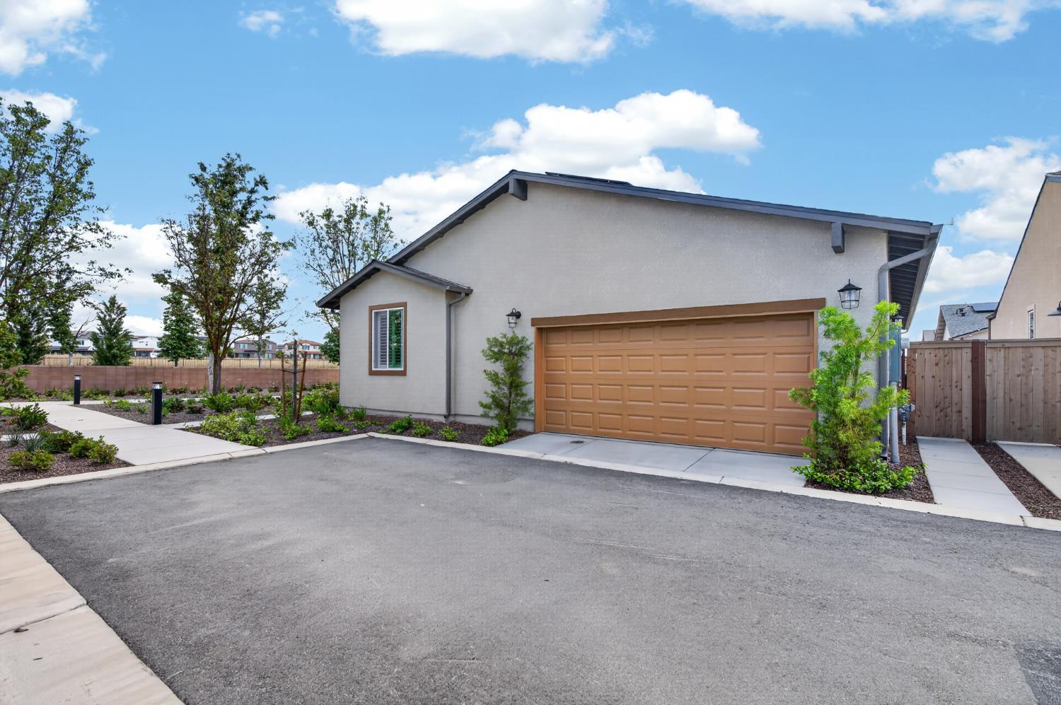 4185 Ryan Lane Madera, CA 93636 - Photo 14 of 63 a view of a house with a yard and garage