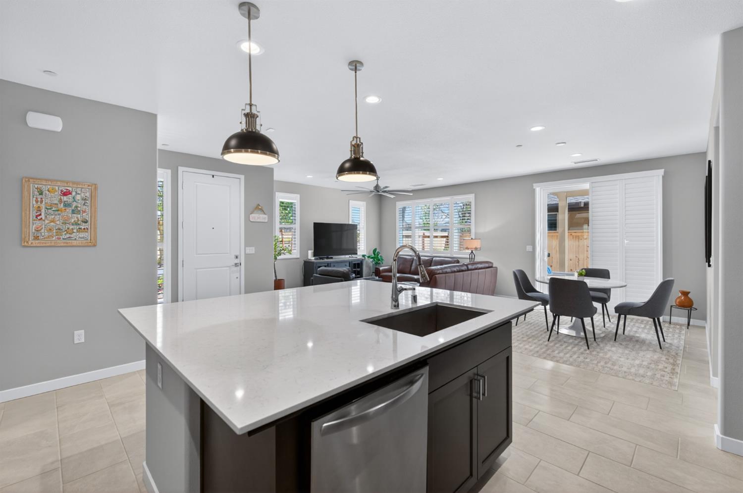 4185 Ryan Lane Madera, CA 93636 - Photo 25 of 63 a kitchen with stainless steel appliances granite countertop a sink a center island and couches