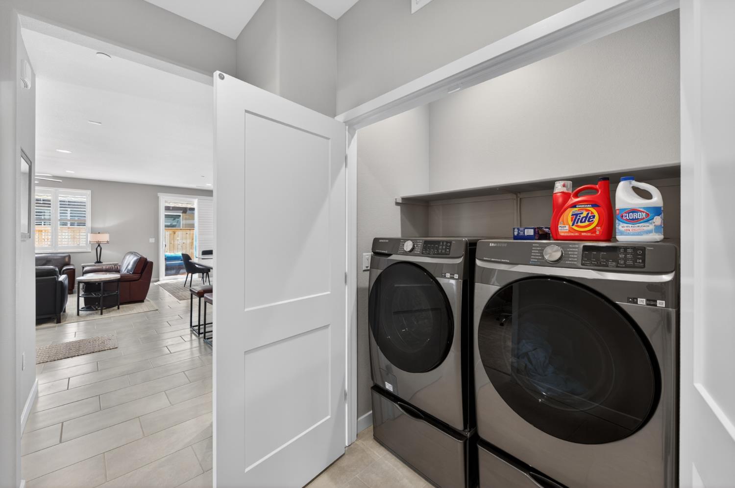 4185 Ryan Lane Madera, CA 93636 - Photo 32 of 63 a utility room with dryer washer and a view of living room