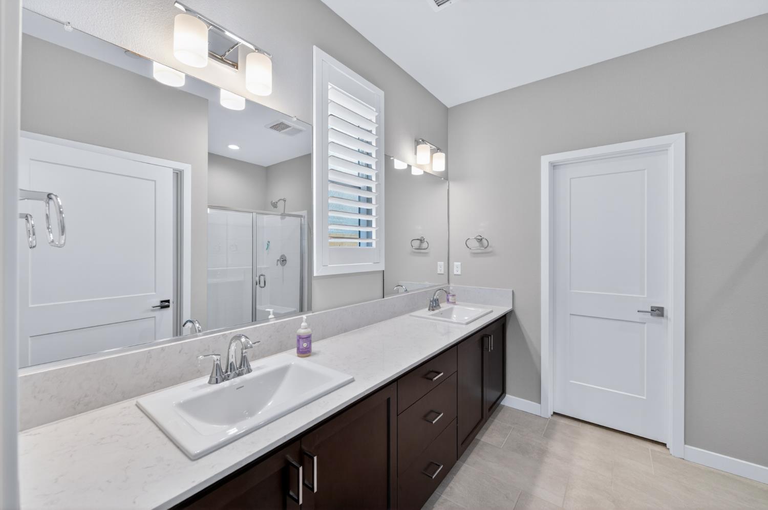 4185 Ryan Lane Madera, CA 93636 - Photo 35 of 63 a bathroom with a double vanity sink mirror and double