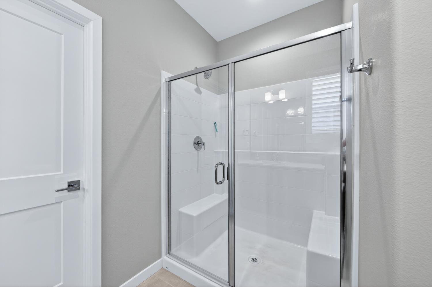 4185 Ryan Lane Madera, CA 93636 - Photo 36 of 63 a bathroom with a glass shower door