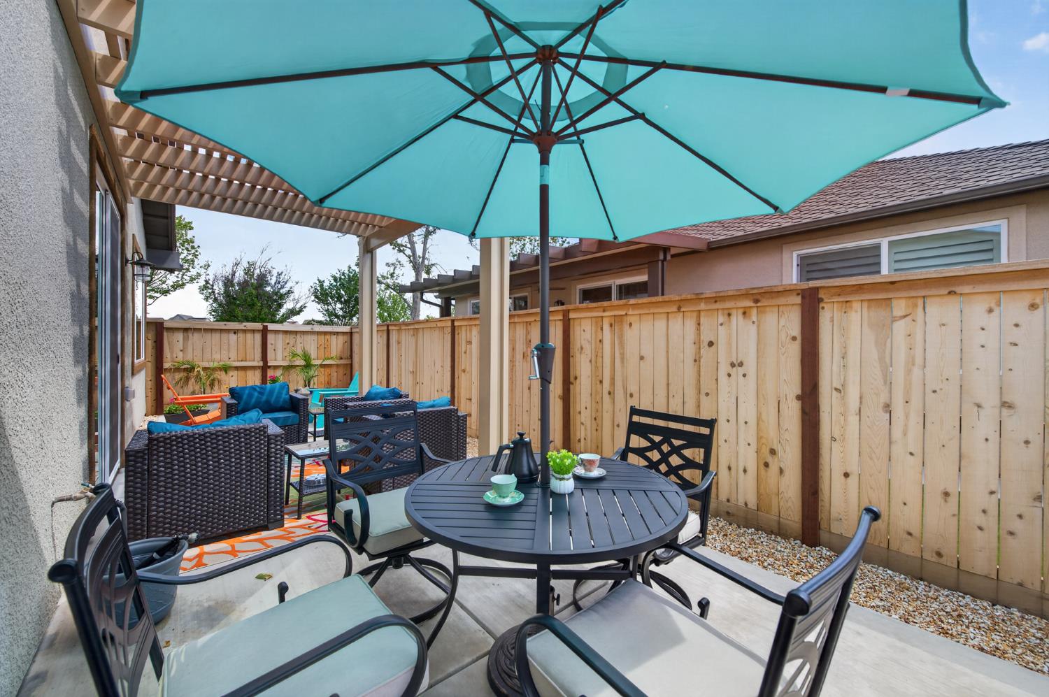 4185 Ryan Lane Madera, CA 93636 - Photo 42 of 63 a view of a backyard with furniture and umbrella