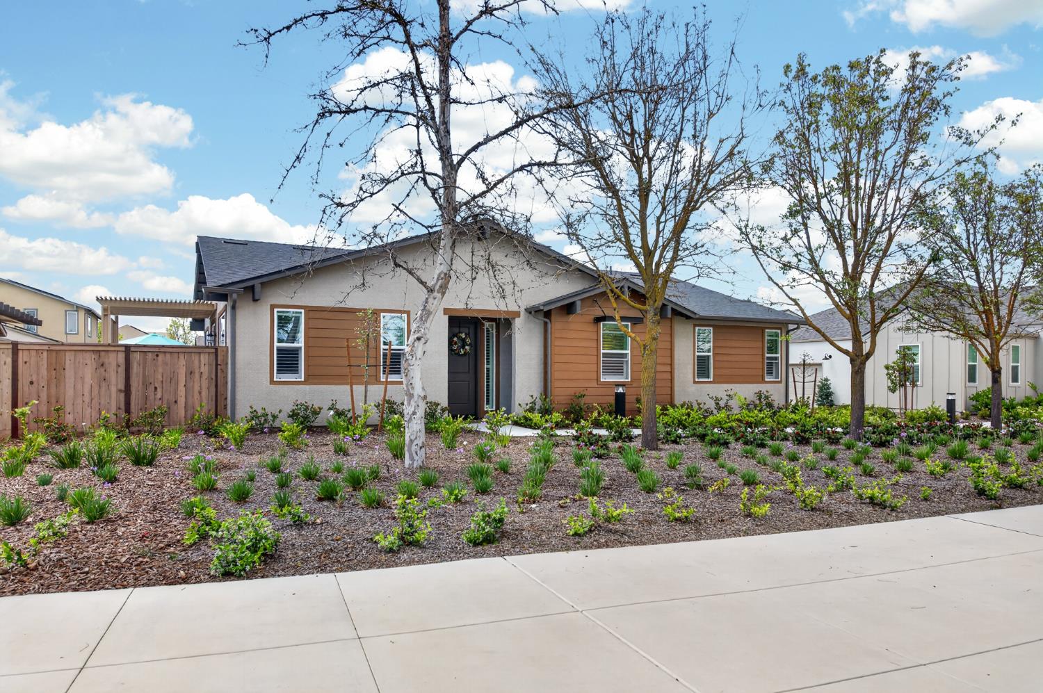 4185 Ryan Lane Madera, CA 93636 - Photo 6 of 63 a front view of a house with a garden