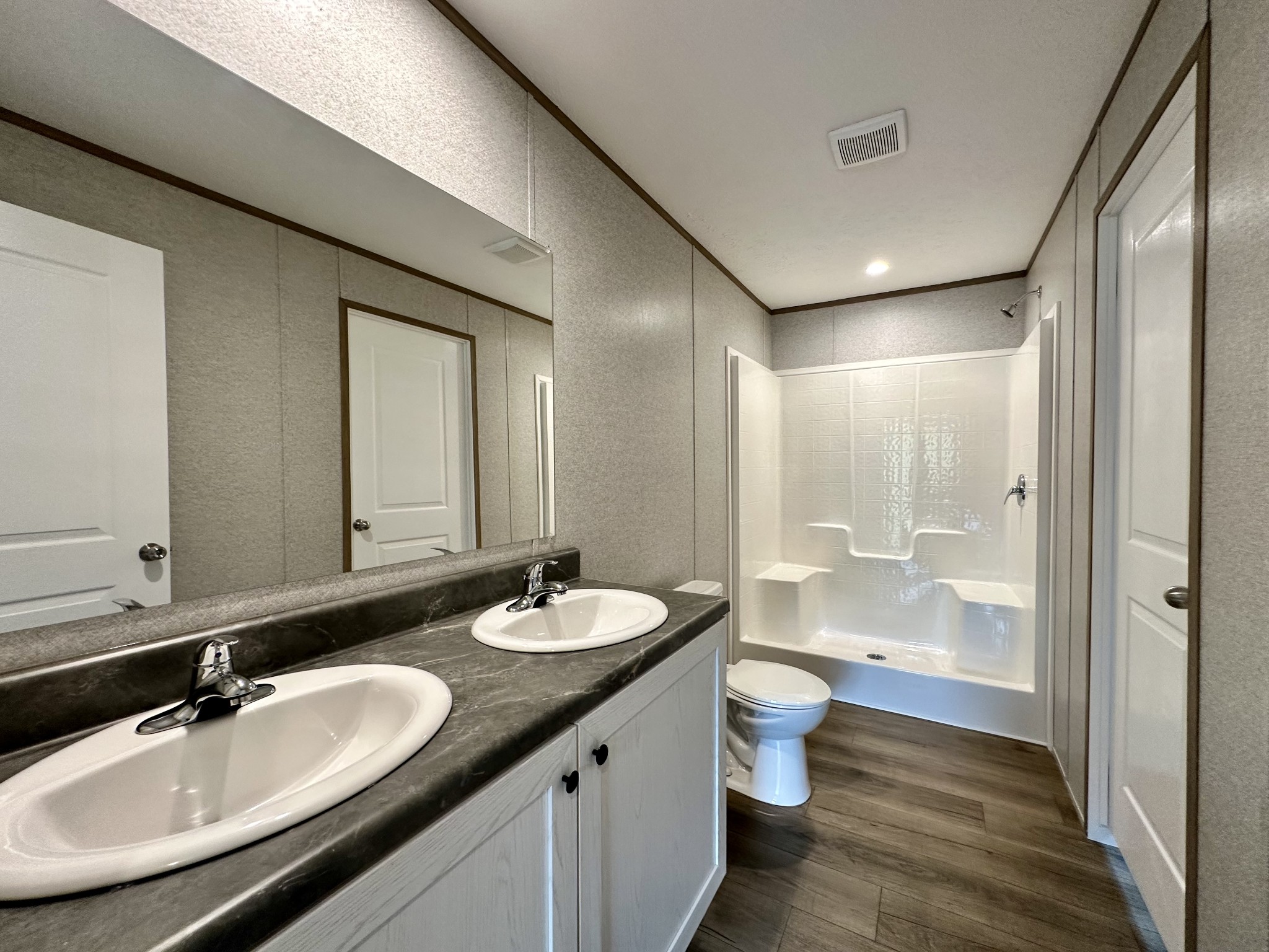 1671 Rabe Coats Road Westmoreland, TN 37186 - Photo 12 of 15 a bathroom with a double vanity sink toilet mirror and shower