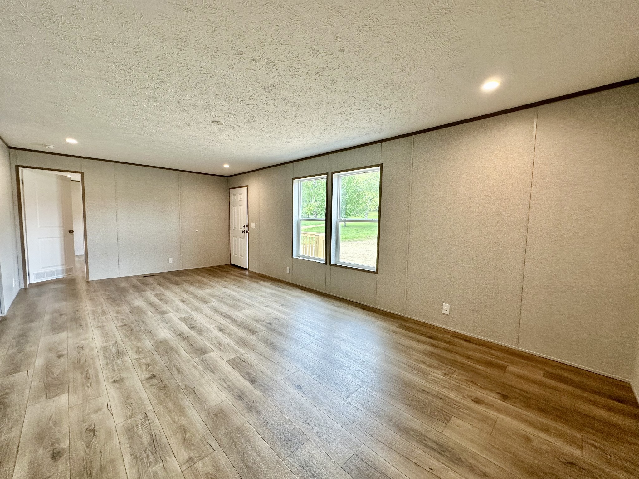 1671 Rabe Coats Road Westmoreland, TN 37186 - Photo 6 of 15 a view of an empty room with wooden floor and a window