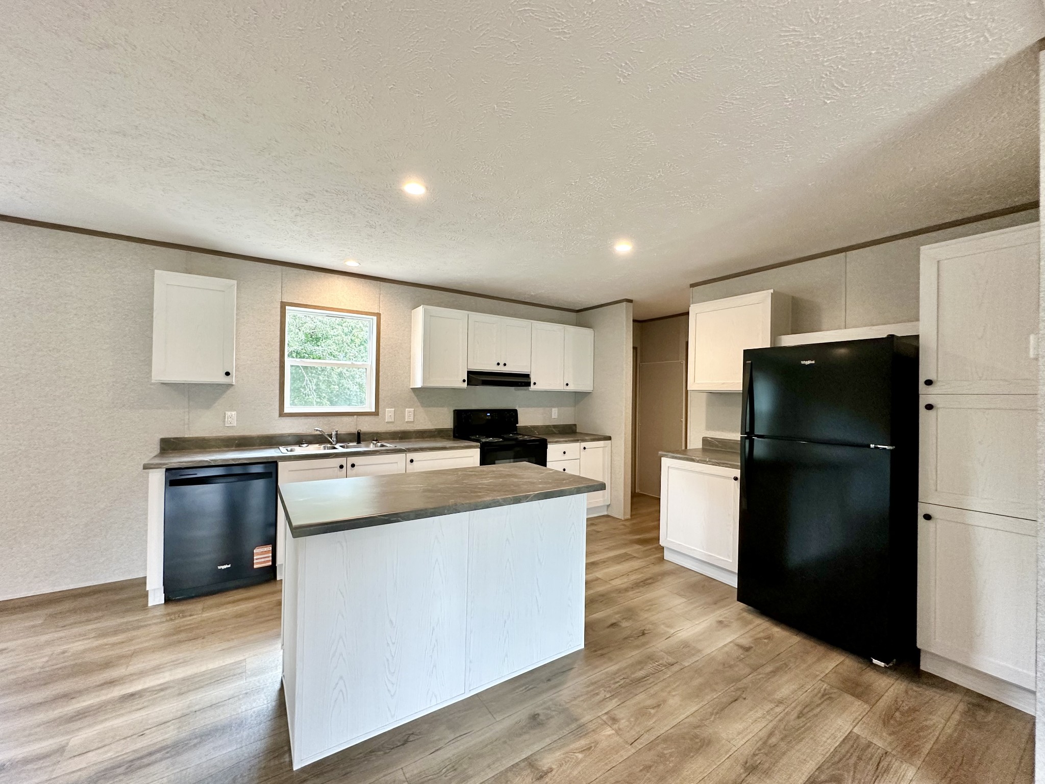 1671 Rabe Coats Road Westmoreland, TN 37186 - Photo 9 of 15 a kitchen with refrigerator and cabinets