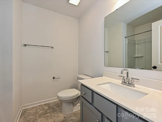 a bathroom with a sink a mirror and a bathtub