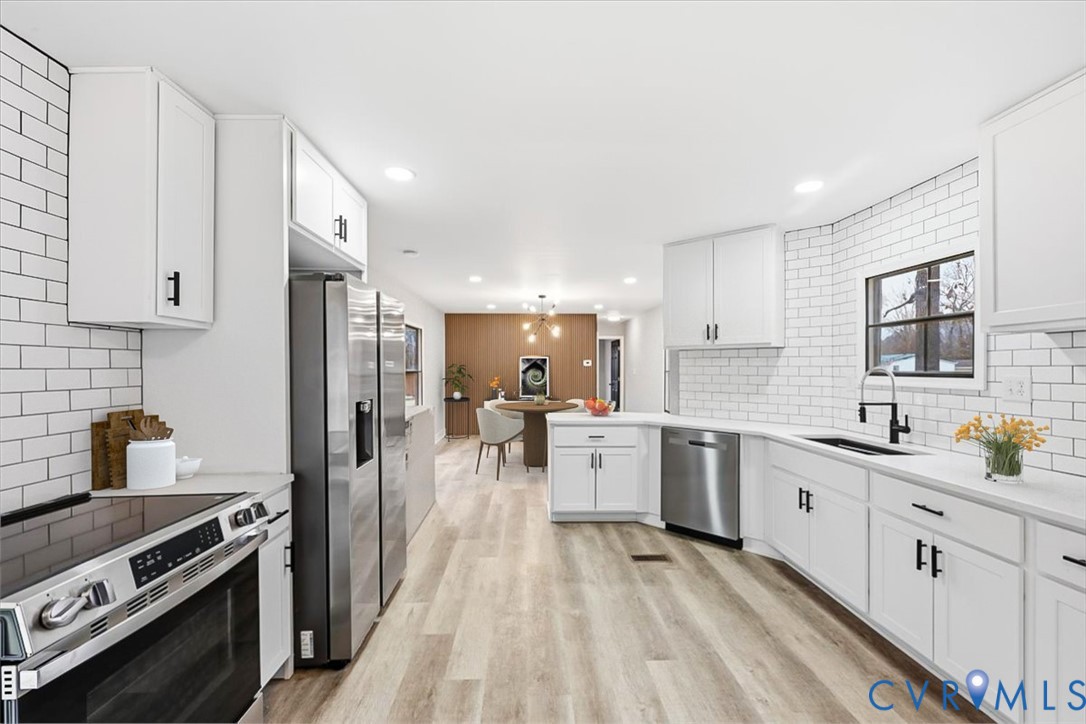 2007 Circlestone Court Colonial Heights, VA 23834 - Photo 3 of 24 a large kitchen with white cabinets and stainless steel appliances