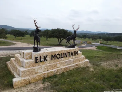a front view of a house with garden space and outdoor seating