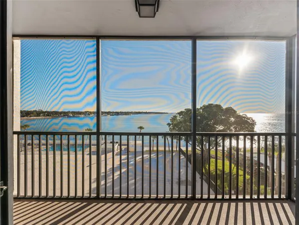 a view of balcony with wooden floor