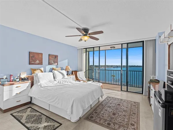 a large white bed in a white room