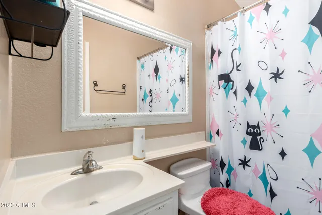 a bathroom with a sink toilet and bathtub