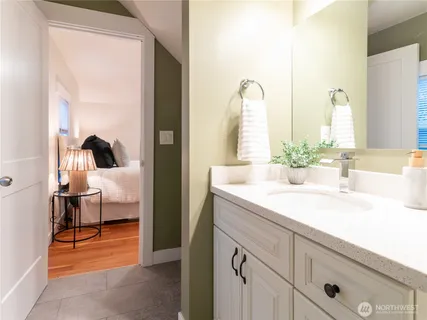 a en suite bathroom with a sink and a mirror