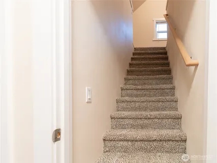a view of empty room with floor to ceiling window