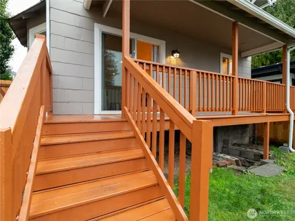a front view of a house with a yard chairs