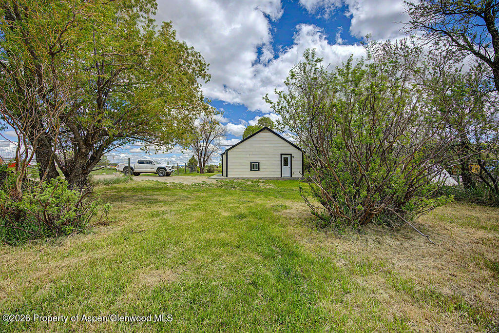 54 South Ranney Street Craig, CO 81625 - Photo 29 of 32 a view of a house with a yard